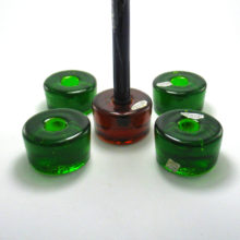 Blenko glass puck candlestick holders came in a variety of colors. Designed in the 1960s.