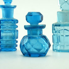 Beautiful round faceted blue glass perfume bottle made in France.