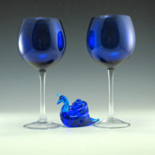 Tall and elegant cobalt blue blown glass wine balloons. Made of quality vintage glass. Deep luxurious blue balloon vessels with applied drawn colorless stem.
