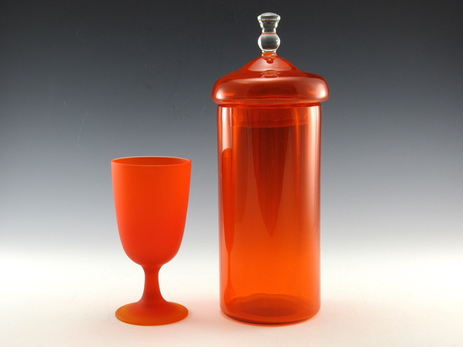Blown into an optic mold with bright orange quality vintage glass. Orange was a favorite color in the 1960's to 1970's.