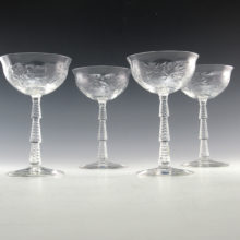 Quality Art Deco cut crystal stemware set of four dessert, cocktail or champagne goblets. The crystal blanks were made in the 1930's by Libbey and decorated by Cataract-Sharpe which had been cutting crystal decor since 1918. This luxurious leaded crystal with superior cut decor is known as Libbey Rock Sharpe.