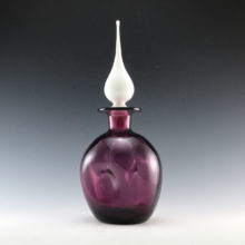 Mid-Century Decor decanter made by Rainbow Art Glass in the 1960's. This decanter would originally have a long matching purple flame stopper. The stunning and rare milk glass flame stopper has been 'married' to this decanter. It fits well and looks stunning.