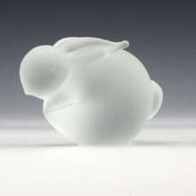 This satin glass bunny rabbit can sit on the dining table as a "table charm". In the late 1800's to early 1900's fine dining tables would feature little creatures scattered about to induce conversation. A nice addition to your favorite bunny lover's collection.
