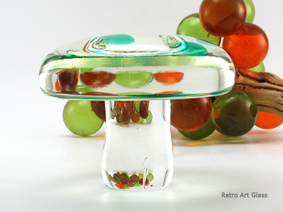 Image no. 5 illustrates the high clarity and reflective qualities of the glass. The mushroom took on the giant Lucite grape reflection.