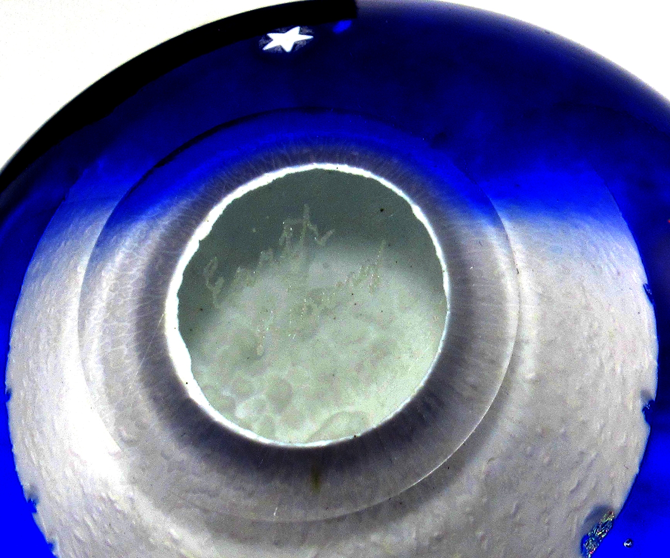 Etched signature reads 'Earth Rising'