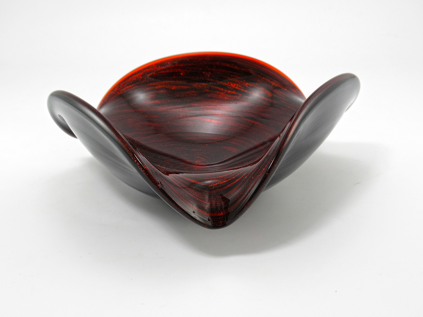 This large free-form tri-corner Murano art glass bowl has all the features of Fratelli Toso art glass. We've seen many in the same shape and design style with the Toso label. But we have not seen the bright red aventurine swirl identified as a Toso. We are 99% sure this is a Fratelli Toso creation.