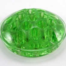 Large antique Uranium glass flower frog was made in the 1920's to 1930's for assistance in flower arranging. This large domed frog was made of Uranium glass which fluoresces bright glowing green under ultraviolet (black) light. 