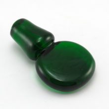 Hand-made solid emerald green glass stopper measures 5" long. Made in the U,S.A. during the Mid-Century Modern decor period (1940's to 1970's). Solid glass.