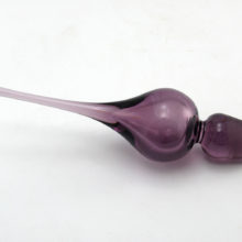 Hand-blown light amethyst glass stopper measures 7.5" long. Made in the U,S.A. during the Mid-Century Modern decor period (1940's to 1970's). It is in perfect condition.