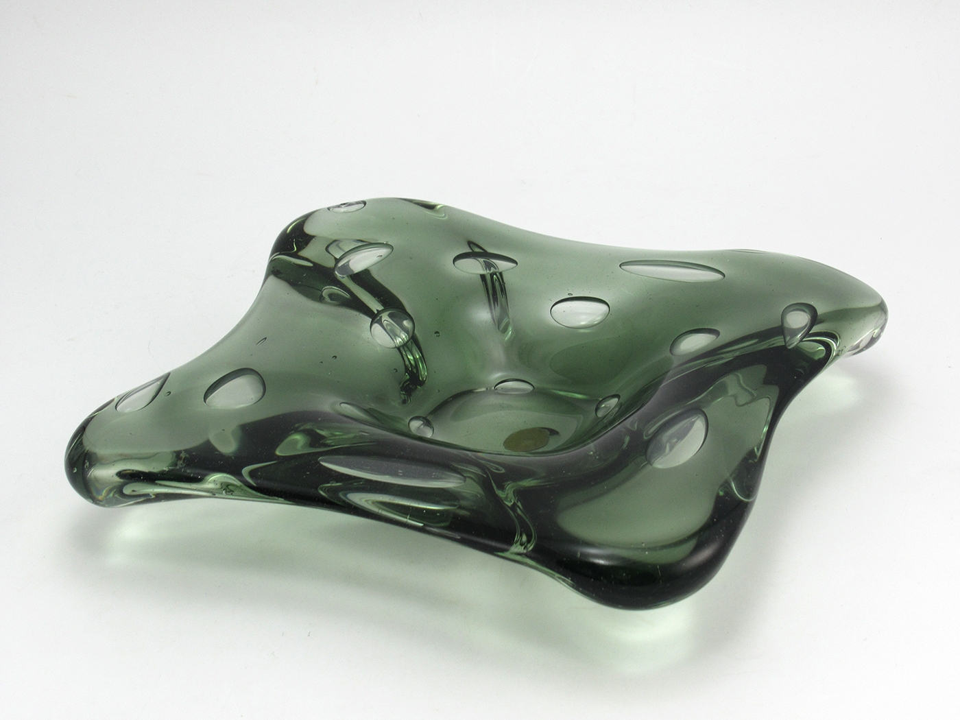This beautiful Murano glass bowl is hand-made and hefty. Measures 7" x 7" and weighs 2 lbs. It has many uses; flower bowl, catch-all, large candle holder, ashtray, fruit dish, etc. It is in excellent, original condition.