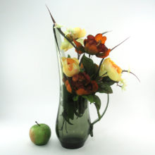 The form is exceptional for flower arranging. The long spout and elaborate handle provide draping areas for flowers.