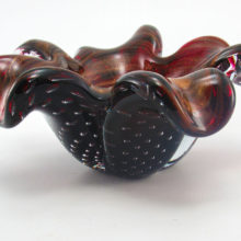 Mesmerizing Barovier & Toso Murano bowl hand-made with ruby glass, intentional bubbles and swirls of gold.Created with 2½ pounds of ruby glass.