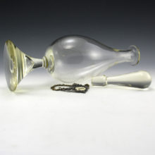 The heavy bell shaped foot has a big intentional teardrop air bubble trapped inside. The unusual and decorative form of the foot stabilizes the large decanter.