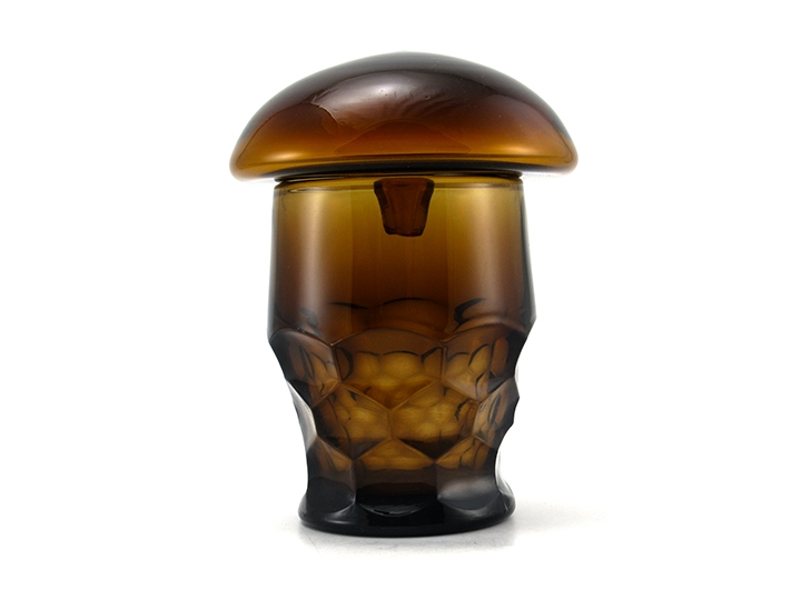 This glass mushroom stopper atop a cinnamin brown retro tumbler illustrates the cap 'floating' over a large opening.