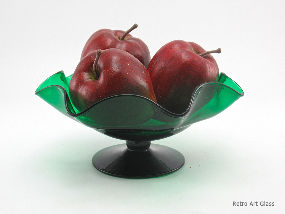 This is a high quality piece. The emerald glass color is rich and jewel-like. The form is elegant and well-designed. Maker unknown. Probably American-made by one of the finer glass houses of the past like Cambridge or Duncan Miller.