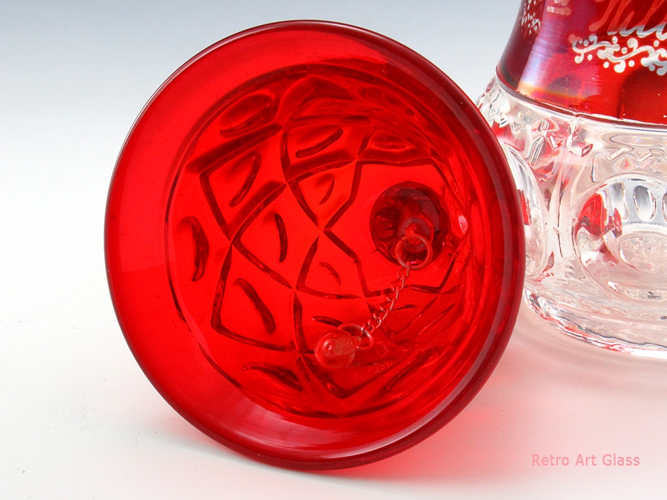 In excellent condition with a glass ringer. Creates a lingering, pleasant tone. Mesmerizing quality ruby glass of yesteryear.