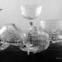 The stemware and bowls have optic panels, hand-cutting/engraving, and fire-polished finishing.  Superb quality crystal. They produce long, lingering tones when plinked.