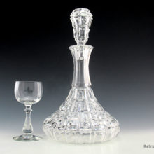 Antique crystal decanter with original hollow, ground to fit stopper. Made of quality, thick leaded crystal. Weighs 4½ Lbs. Stands 12" tall.