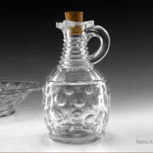 Antique glass bowl measures 7" round and 2" tall. Antique glass cruet sized jug is 5¾" tall. Circa estimated to the EAPG era, 1850 to 1910. Probably American made, but could be Irish.