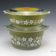 Vintage Pyrex casserole dishes in Crazy Daisy with lids. Excellent condition.