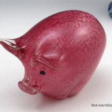 Hand-made pig paperweight in pink mottled glass with applied eyes.